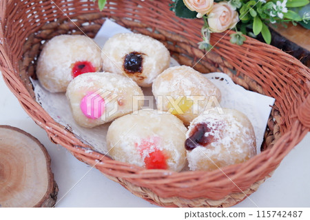 flavored ball donuts as a background flavored ball donuts as a background 115742487