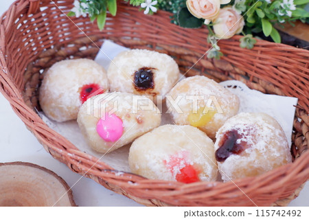 flavored ball donuts as a background flavored ball donuts as a background 115742492