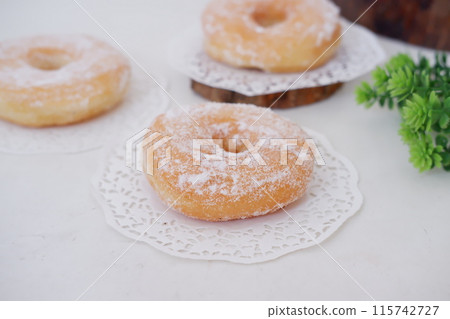 donuts with powdered sugar on top as a background 115742727