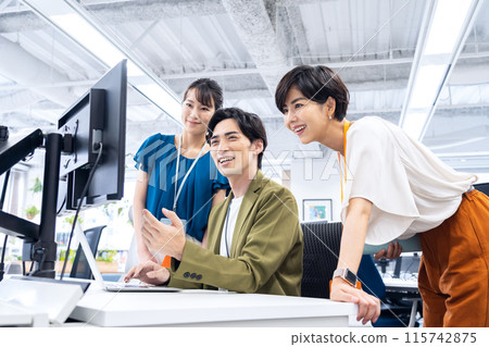 Young male and female engineers having a meeting in the office 115742875
