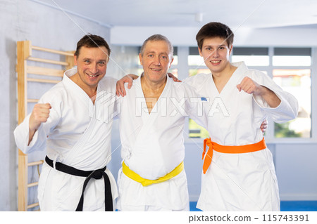 Group of male karatekas posing in studio Group of male karatekas posing in studio 115743391