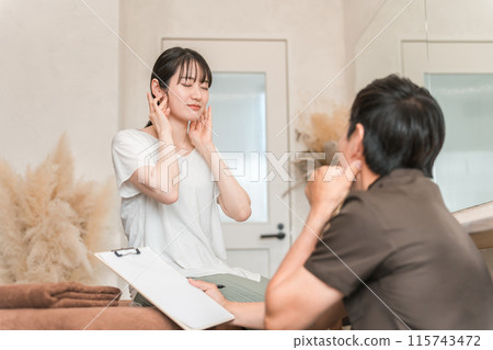 A woman receiving lymphatic massage and lymphatic massage counseling and a therapist 115743472