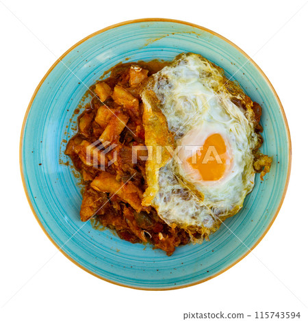 Rich cod stew in garlic and tomato salsa with fried egg Rich cod stew in garlic and tomato salsa with fried egg 115743594