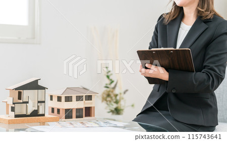A woman who is a house planner, real estate agent, financial planner, and mortgage advisor 115743641