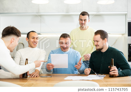 Happy men celebrating successful deal at informal friendly meeting 115743705
