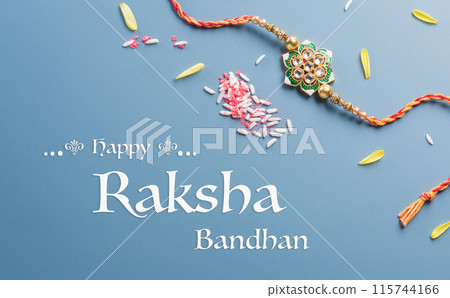 Raksha Bandhan, Indian festival with beautiful Rakhi, Rice Grains and flower. A traditional Indian wrist band which is a symbol of love between Sisters and Brothers 115744166