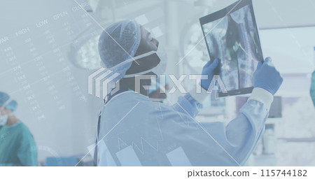 Image of infographic interface, african american doctor anaylzing x-ray report at operation room 115744182