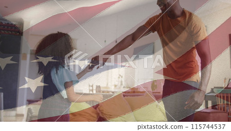 Image of flag of united states of america over african american father and daughter dancing 115744537