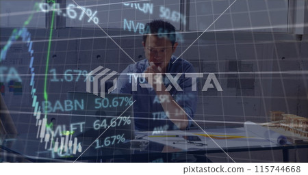 Stock market data processing over asian male engineer using laptop at office 115744668