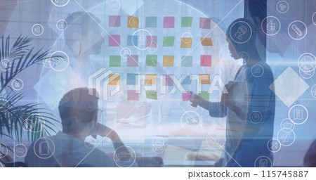 Image of icons and folders over diverse businesspeople working in office Image of icons and folders over diverse businesspeople working in office 115745887