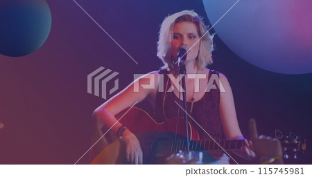 Image of spheres over caucasian woman playing acoustic guitar and singing into microphone Image of spheres over caucasian woman playing acoustic guitar and singing into microphone 115745981