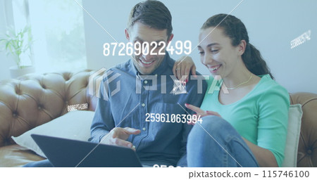 A young caucasian couple talking and paying their bills using a laptop domestic life and responsibil 115746100