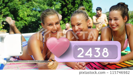 Close up of three Caucasian women laying on the beach tacking selfies Close up of three Caucasian women laying on the beach tacking selfies 115746982