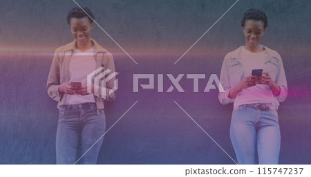 Image of smiling african american women using smartphones Image of smiling african american women using smartphones 115747237