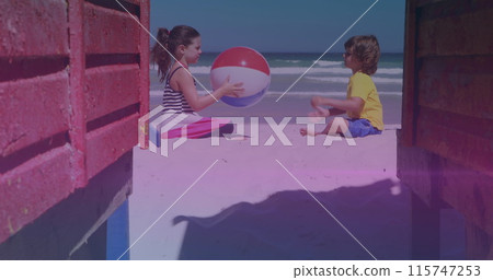 Pink and blue light trails against caucasian brother and sister playing with beach ball at the beach Pink and blue light trails against caucasian brother and sister playing with beach ball at the beach 115747253