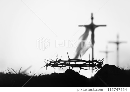 Silhouette of the cross and crown of thorns symbolizing Jesus' trials and tribulations, and Easter background for Passion Week and Lent 115747334