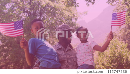 African american father in soldier uniform carrying his son and daughter in the garden 115747386