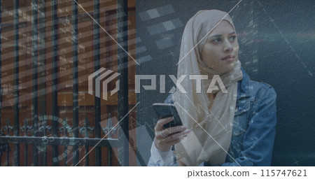 Image of financial data and graphs over middle easters woman using smartphone 115747621