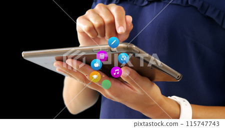 Image of colorful icons over biracial woman using tablet Image of colorful icons over biracial woman using tablet 115747743