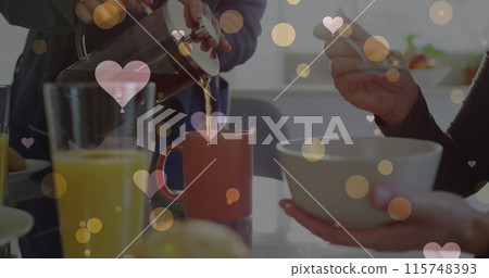 Image of hearts over caucasian female couple eating breakfast Image of hearts over caucasian female couple eating breakfast 115748393