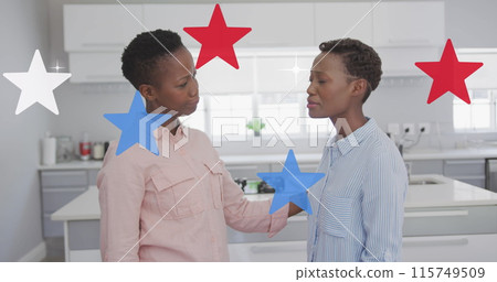 Image of stars in colours of flag of usa over smiling african american women Image of stars in colours of flag of usa over smiling african american women 115749509
