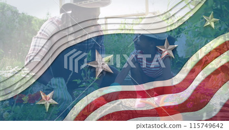 Image of flag of usa waving over african american father and daughter gardening plants 115749642