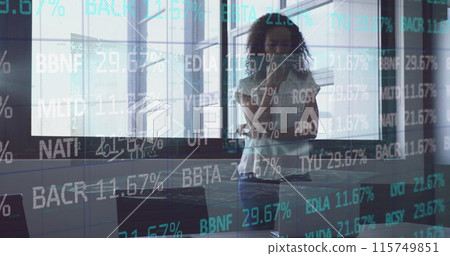 Image of financial data over biracial businesswoman working in office Image of financial data over biracial businesswoman working in office 115749851