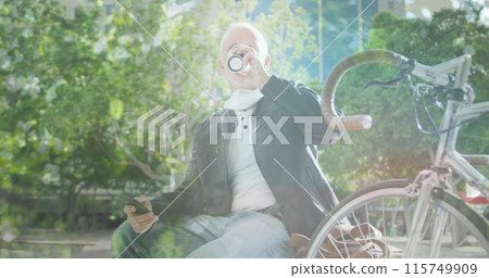 Image of leaves over caucasian man drinking takeaway coffee 115749909