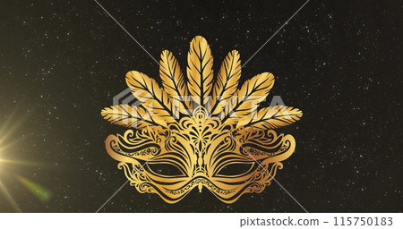 Image of gold mask over black background with light 115750183