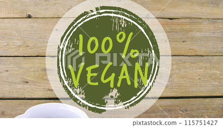 Image of 100 percent vegan text over bowl of fresh fruit 115751427