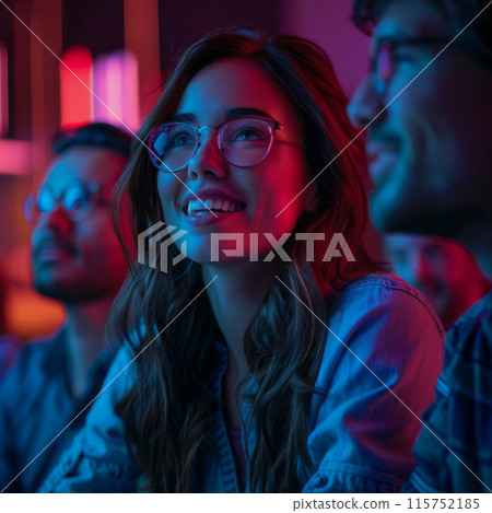A woman with glasses is smiling at the camera 115752185