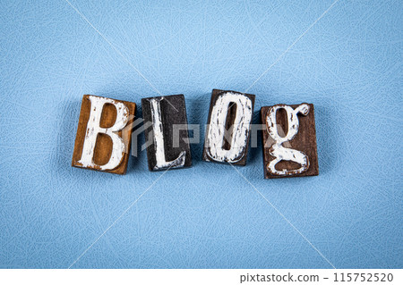 BLOG. Wooden alphabet letter blocks on blue textured background BLOG. Wooden alphabet letter blocks on blue textured background 115752520