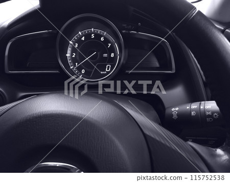 Interior view of car speedometer with steering wheel. Interior view of car speedometer with steering wheel. 115752538
