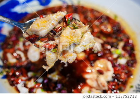 Poached sliced sea bass with vegetables and spicy seasoning, Chinese food 115752718