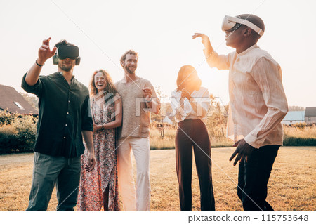 A diverse group of friends is having fun with outdoor virtual reality activities during sunset A diverse group of friends is having fun with outdoor virtual reality activities during sunset 115753648