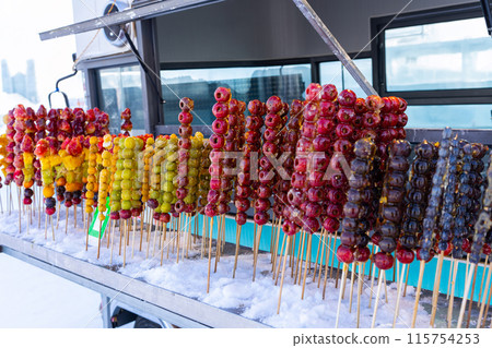 Tang hulu or Chinese sugar-coated fruit stick. The snack of China in the Winter Tang hulu or Chinese sugar-coated fruit stick. The snack of China in the Winter 115754253