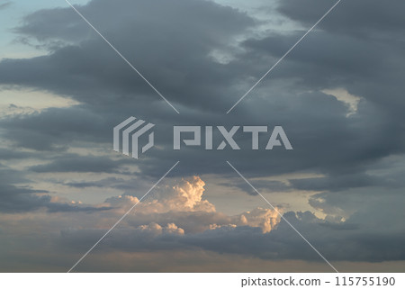 The sky is being covered with fluffy white clouds. The sky is being covered with fluffy white clouds. 115755190