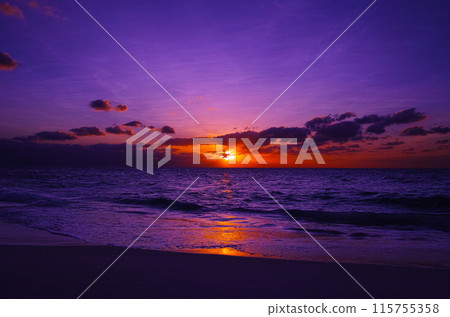 Miyakojima in midsummer. Sunset seen from Nagamahama beach on Kurima Island 115755358