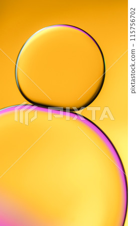 Top view of macro abstract photography of oil droplet on golden yellow gradient background for use as background, illustration or copy space Top view of macro abstract photography of oil droplet on golden yellow gradient background for use as background, illustration or copy space 115756702