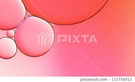 macrophotography of oil and water on gradient pink to white abstract background 115756913