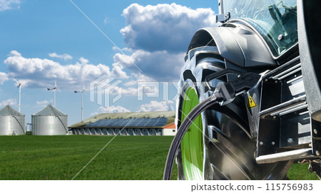 Electric agricultural tractor with connected charging cable. Concept 115756983