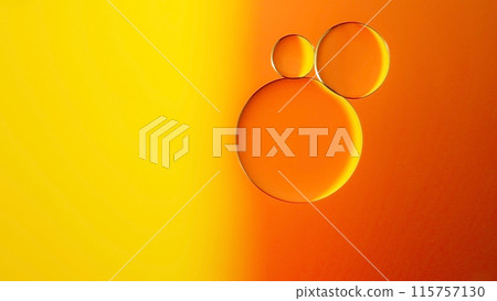 macrophotography of oil and water on gradient yellow to orange abstract background macrophotography of oil and water on gradient yellow to orange abstract background 115757130