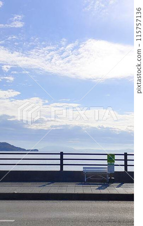 A small bus stop by the sea and a wide sky A small bus stop by the sea and a wide sky 115757136