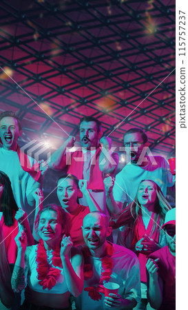 Victorious Cheers. Crowd of supporters, men and women, erupts in joyful celebration, embodying spirit of game. Victorious Cheers. Crowd of supporters, men and women, erupts in joyful celebration, embodying spirit of game. 115757237