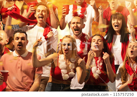 United in Celebration. Lively crowd of fans, men and women, on stands reveling in excitement of final game. United in Celebration. Lively crowd of fans, men and women, on stands reveling in excitement of final game. 115757250
