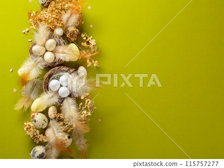 Easter composition with quail eggs, feathers, and dried flowers. 115757277