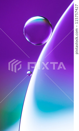 Top view of macro abstract photography of oil droplet on water over the blue to purple gradient background for use as background, illustration or copy space Top view of macro abstract photography of oil droplet on water over the blue to purple gradient background for use as background, illustration or copy space 115757427
