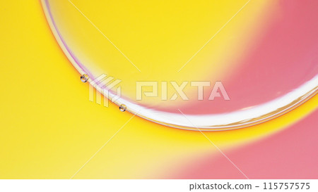 macrophotography of oil and water on gradient yellow to pink abstract background macrophotography of oil and water on gradient yellow to pink abstract background 115757575