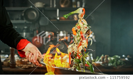 Freeze Motion of Wok Pan with Flying Asian Meal in the Air. Freeze Motion of Wok Pan with Flying Asian Meal in the Air. 115759592