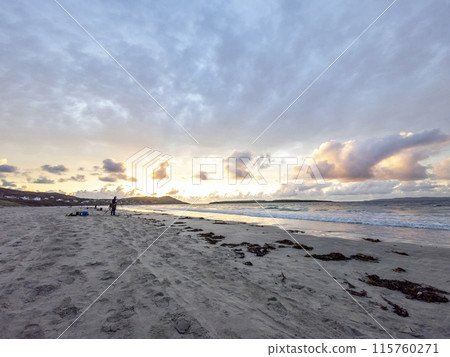 20 man are competing in a fishing competition on the beach. 20 man are competing in a fishing competition on the beach. 115760271